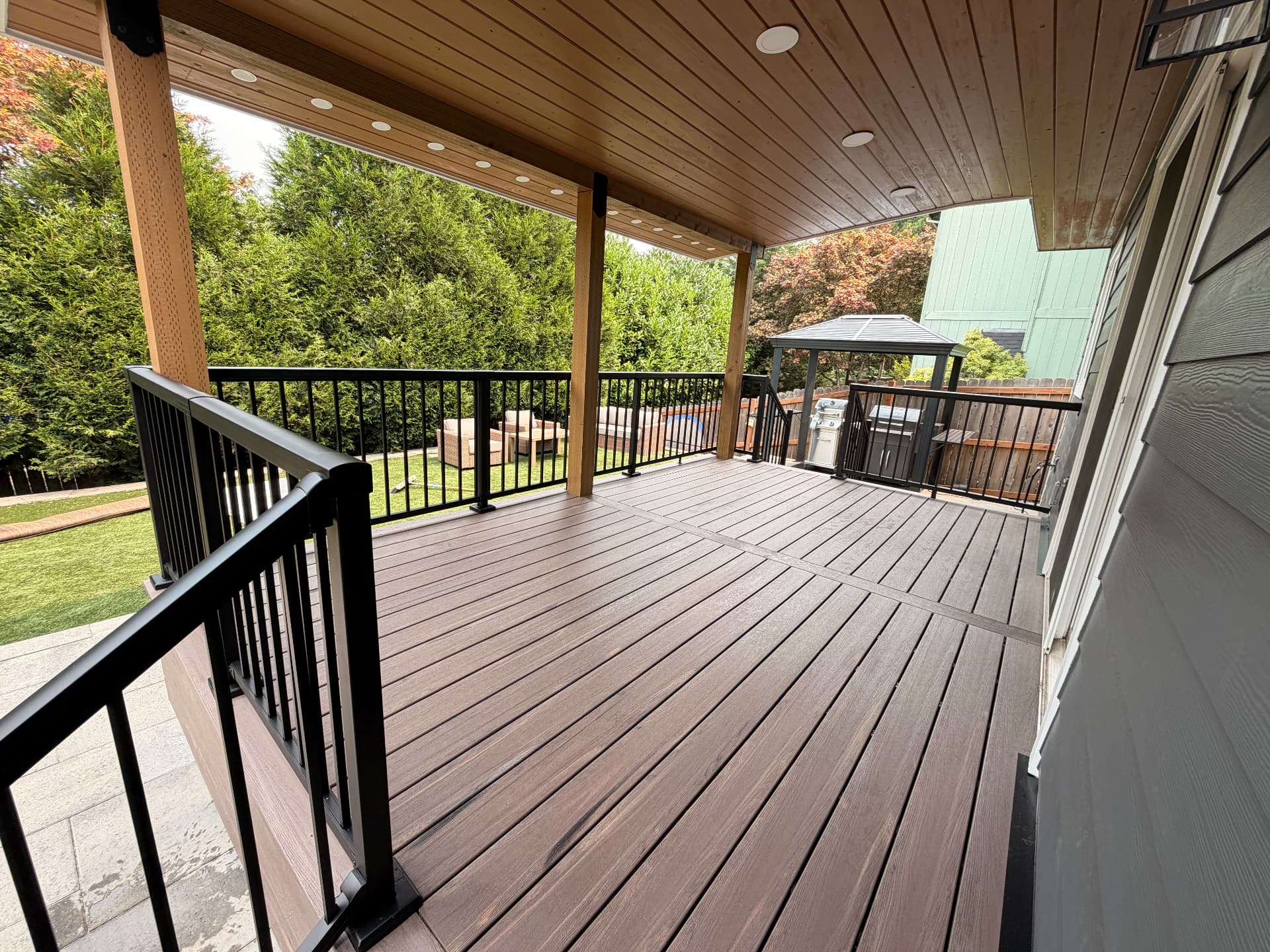 Covered composite deck with black railing